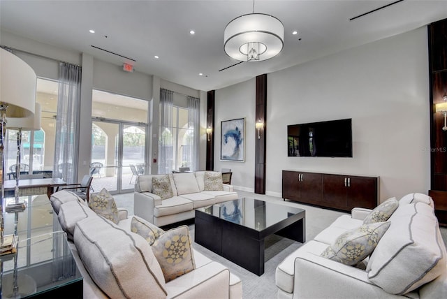 living room with french doors and light colored carpet