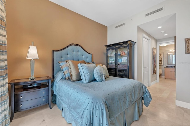 bedroom featuring ensuite bathroom