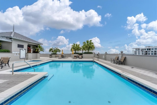 view of swimming pool featuring a patio area