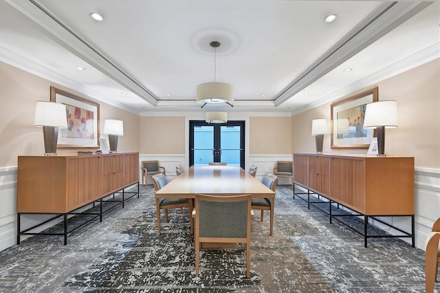 dining space featuring french doors, a tray ceiling, and crown molding