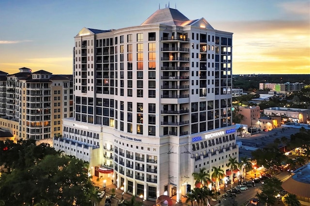 view of outdoor building at dusk