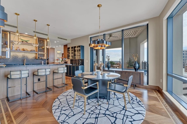 dining room featuring light parquet flooring