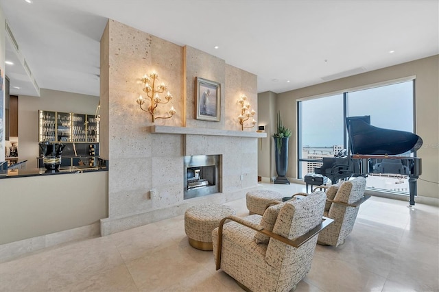 living room with a tiled fireplace