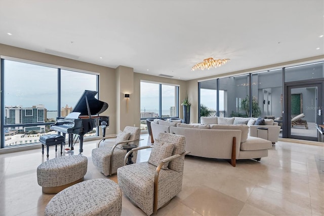 living room featuring a chandelier and a wealth of natural light