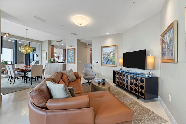 tiled living room with a chandelier