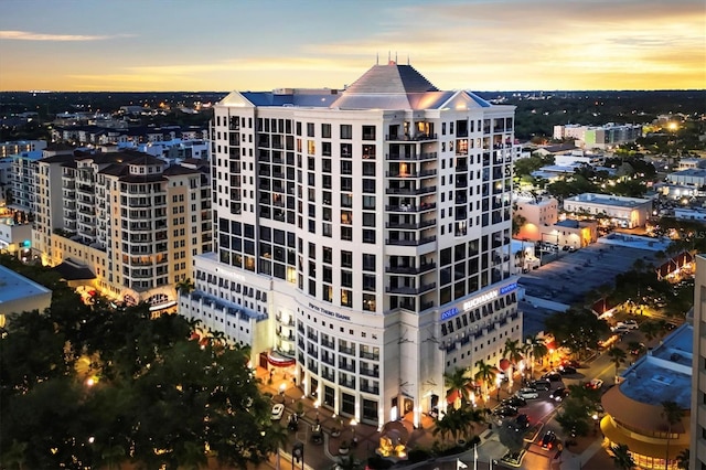 view of outdoor building at dusk