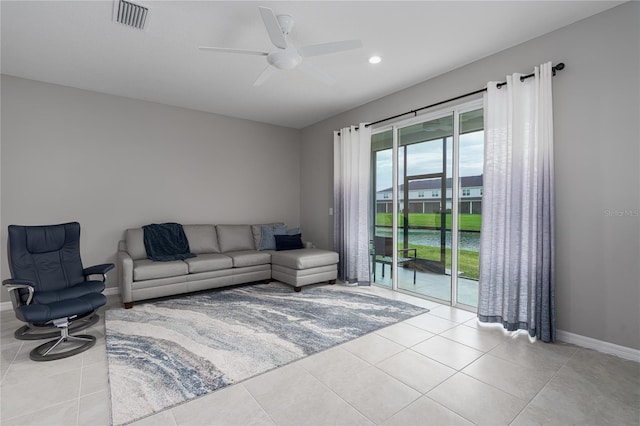 tiled living room featuring baseboards, ceiling fan, recessed lighting, and visible vents