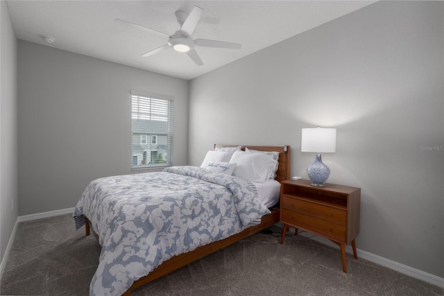carpeted bedroom featuring baseboards and ceiling fan