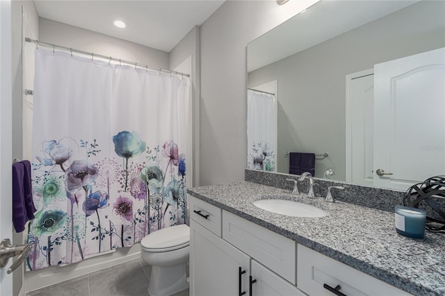 full bathroom featuring vanity, shower / bath combo with shower curtain, toilet, and tile patterned floors