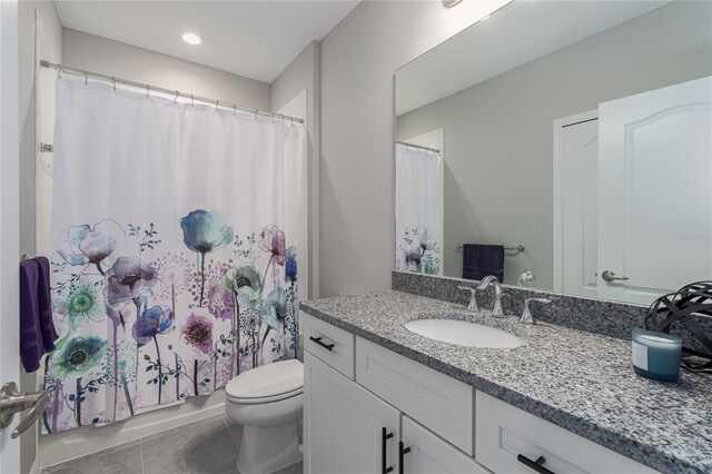 full bath featuring vanity, shower / tub combo with curtain, toilet, recessed lighting, and tile patterned floors