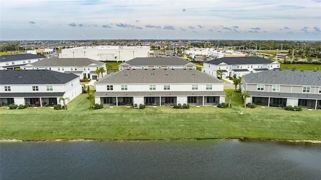birds eye view of property featuring a residential view and a water view