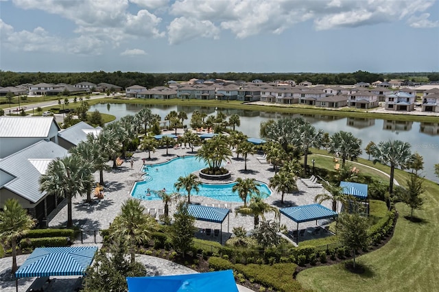bird's eye view with a residential view and a water view