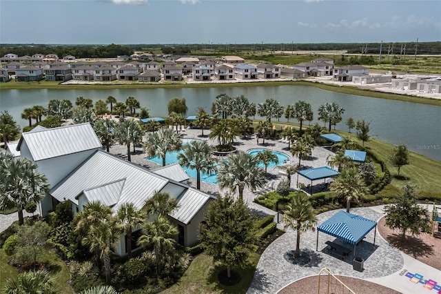 birds eye view of property featuring a residential view and a water view