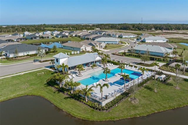 birds eye view of property with a water view