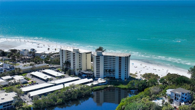 bird's eye view featuring a view of the beach and a water view