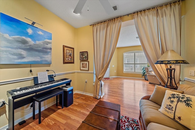 interior space featuring ceiling fan, a textured ceiling, and light wood-type flooring