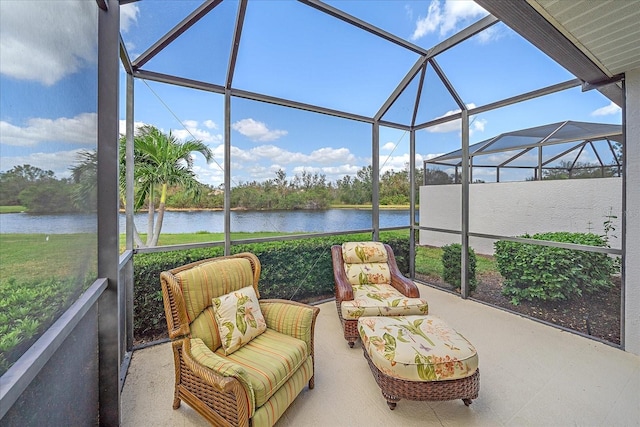 sunroom / solarium featuring a water view