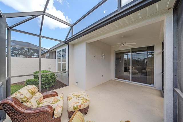 sunroom featuring ceiling fan