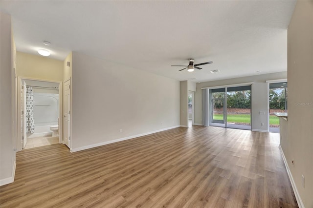 unfurnished room featuring light wood-type flooring and ceiling fan