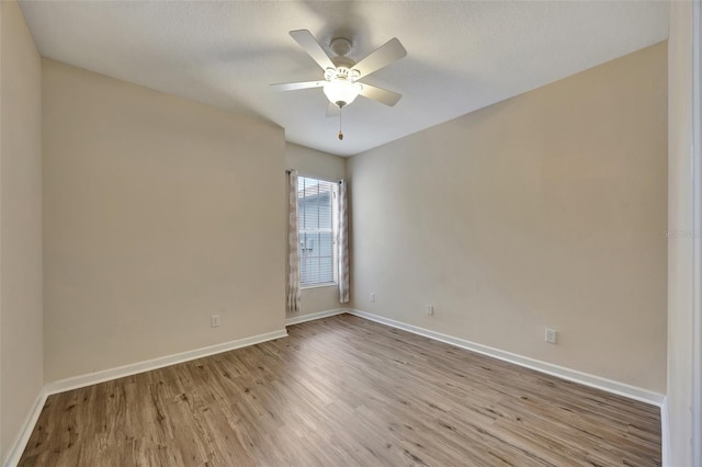 spare room with ceiling fan, a textured ceiling, and light hardwood / wood-style floors