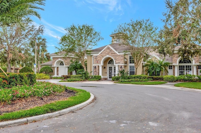 10444 48th Ct E, Parrish, FL 34219 - view of front facade featuring french doors and stone siding