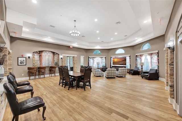 10444 48th Ct E, Parrish, FL 34219 - dining space featuring a tray ceiling, light wood-style flooring, recessed lighting, and baseboards