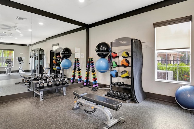 gym featuring ornamental molding and ceiling fan