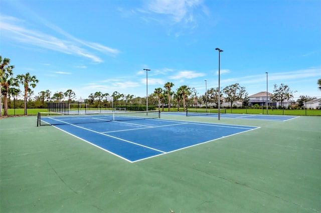 view of sport court with basketball hoop