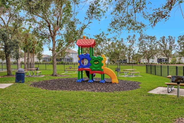 view of jungle gym featuring a lawn