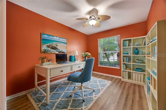 office space featuring ceiling fan and light hardwood / wood-style floors