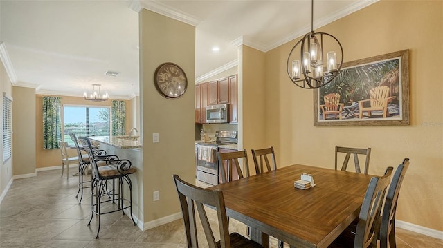 tiled dining area featuring crown molding, sink, and an inviting chandelier