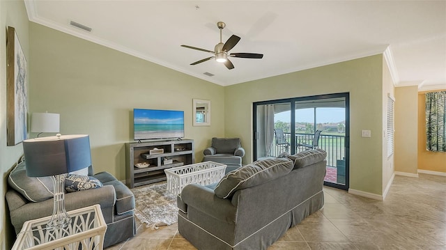 living room featuring ceiling fan, ornamental molding, light tile patterned floors, and lofted ceiling