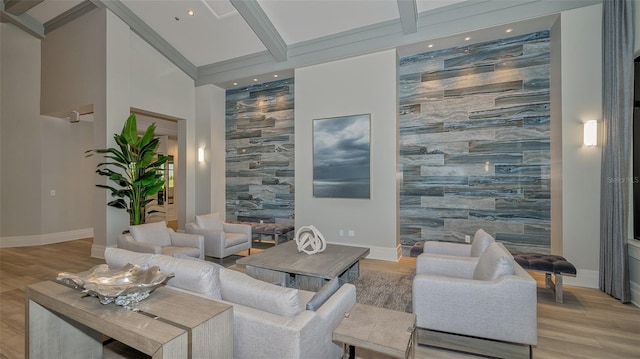 living room with beamed ceiling and light wood-type flooring