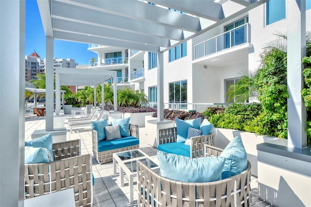 view of patio with a pergola and outdoor lounge area