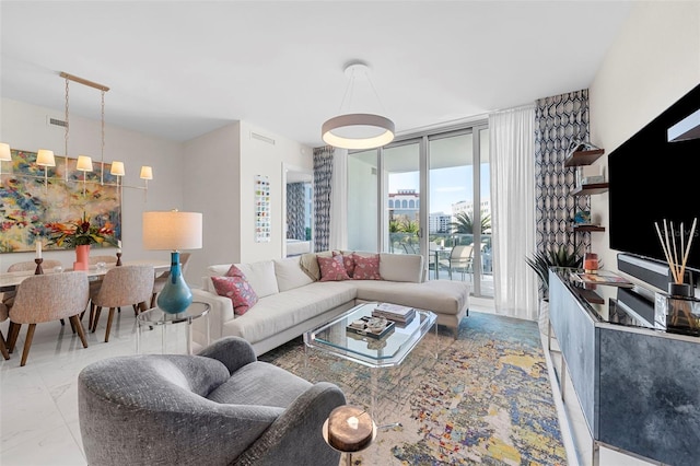 living room with floor to ceiling windows