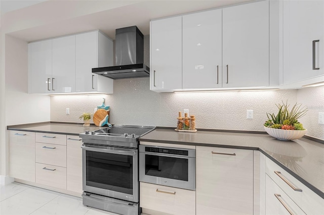 kitchen featuring white cabinetry, tasteful backsplash, wall chimney exhaust hood, and stainless steel electric range