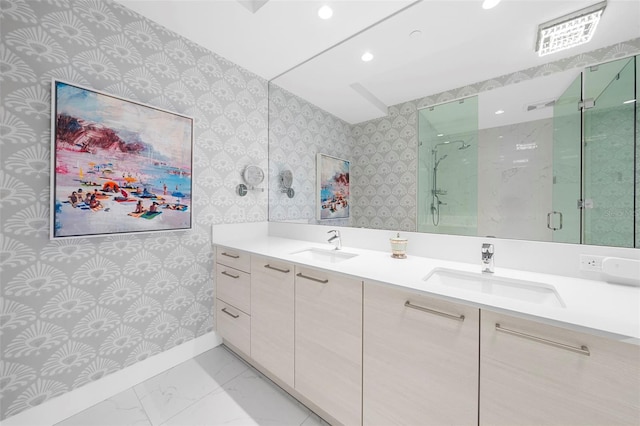 bathroom with vanity and a shower with door