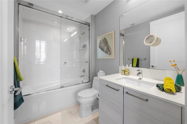 full bathroom with vanity, shower / bath combination with glass door, and toilet