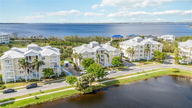 birds eye view of property with a water view