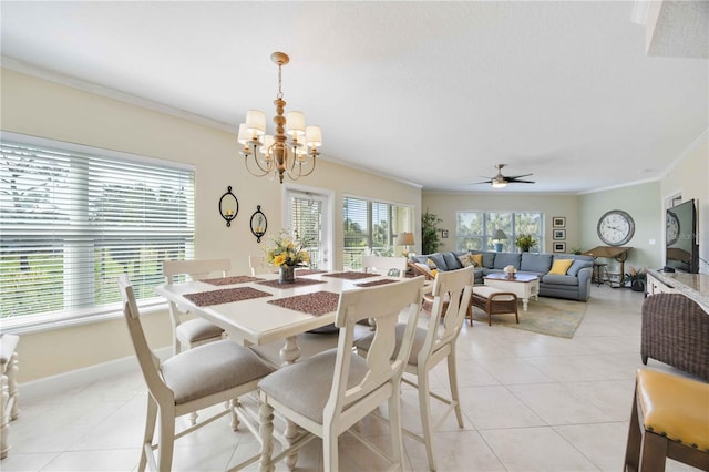 dining room featuring ceiling fan with notable chandelier, ornamental molding, and light tile patterned flooring