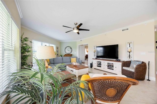 living room with light tile patterned flooring, ceiling fan, and crown molding