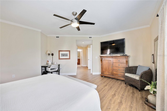 bedroom featuring crown molding, ceiling fan, and light hardwood / wood-style floors