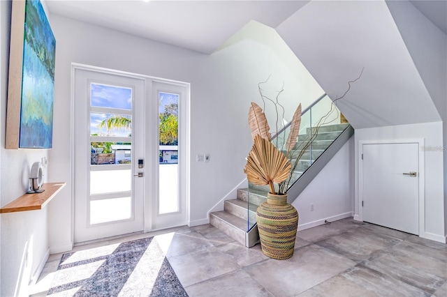 entrance foyer featuring vaulted ceiling