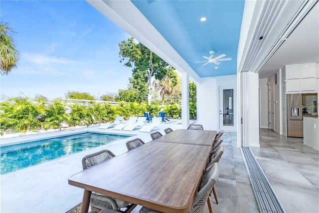 view of pool featuring a patio and ceiling fan