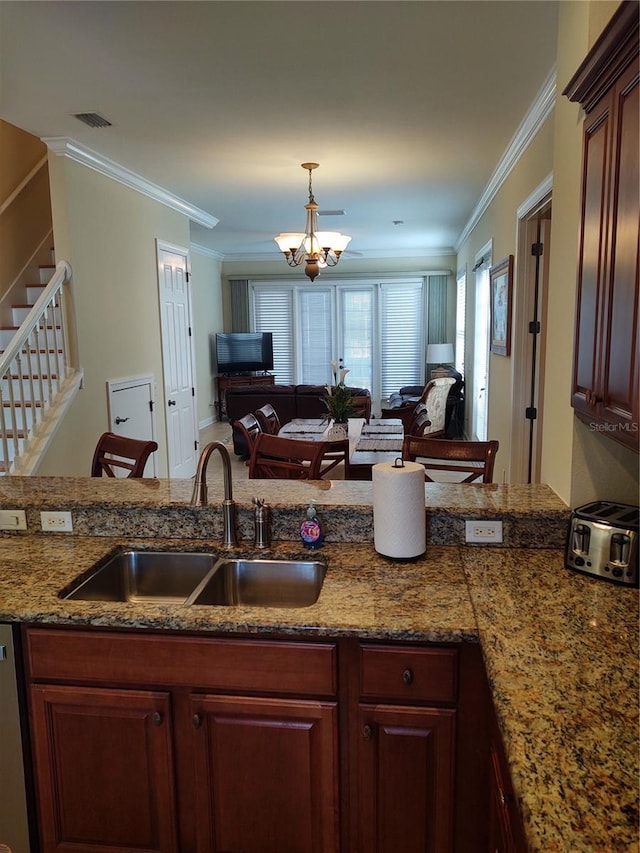 kitchen with stainless steel dishwasher, sink, crown molding, and a chandelier