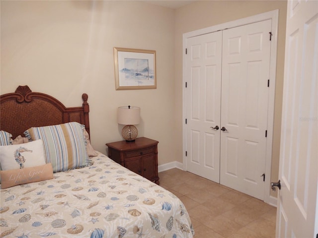 tiled bedroom with a closet