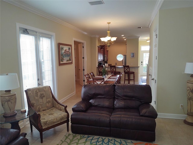 tiled living room featuring crown molding and a chandelier