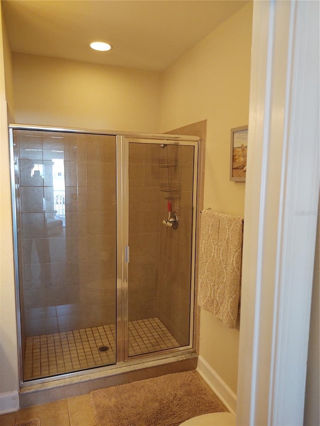 bathroom featuring tile patterned flooring and walk in shower