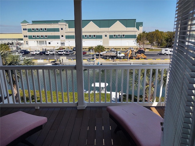 balcony featuring a water view