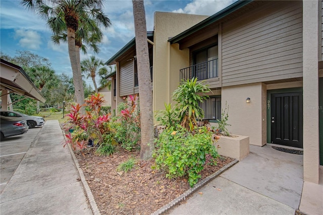 view of side of property featuring a balcony